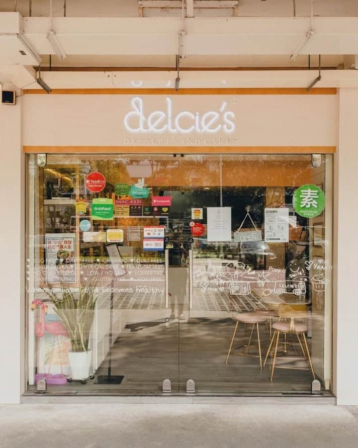 the light pink storefront of delicies bakeshop in singapore