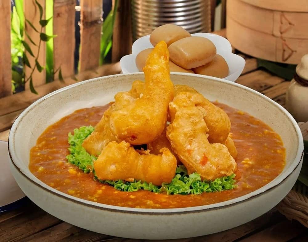 vegan fried shrimp in a thick tomato based broth from lotus vegetarian in singapore