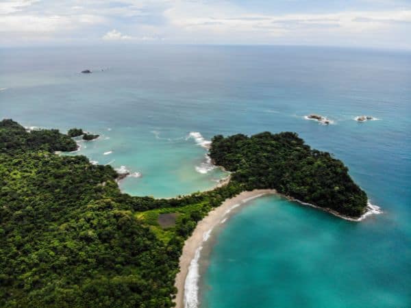 overhead shot of the secluded playa espadilla at manuel antonio national park in costa rica