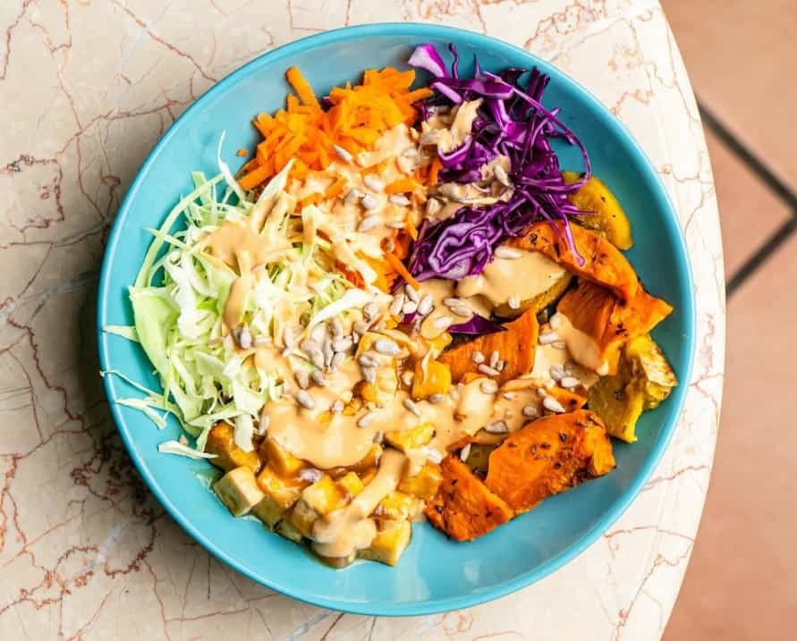bright and colorful vegan burrito bowl filled with mixed veggies from o burrito in coimbra