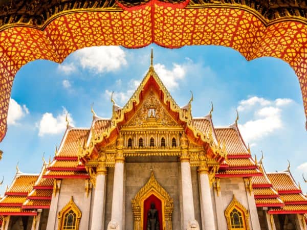 the entrance into the majestic grand palace on a bright and sunny day in thailand