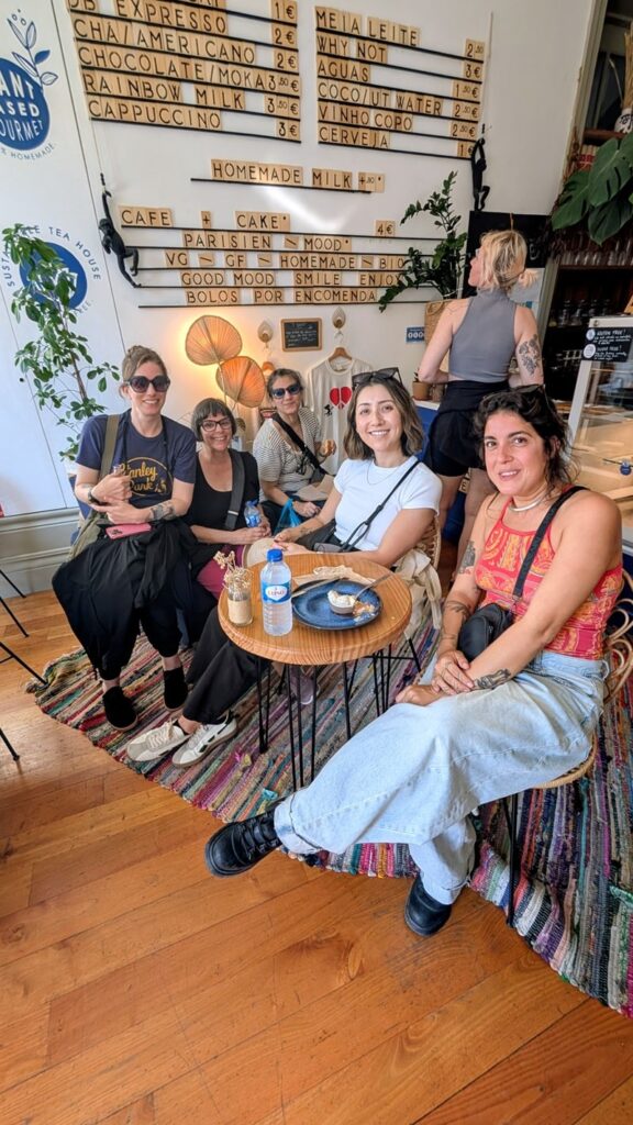 vegan tour group sitting inside of the vegan bakery my green pastry