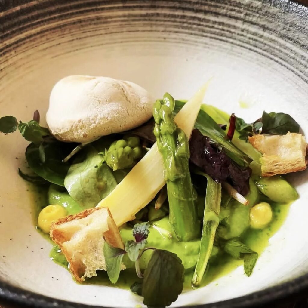 a mix of green veggies with a white cheese at like an elephant in lyon