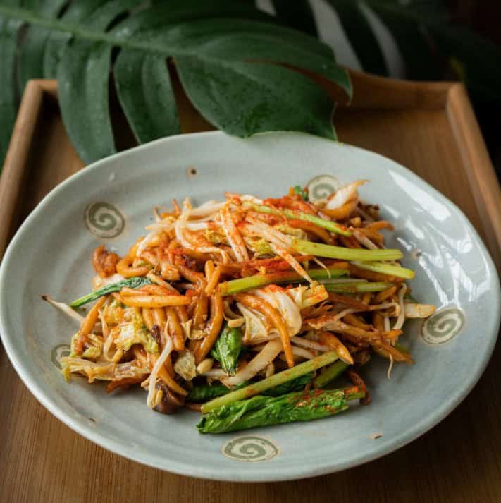 colorful vegan noodle dish with ribbons of carrot on top at sacred lotus in Phnom Penh