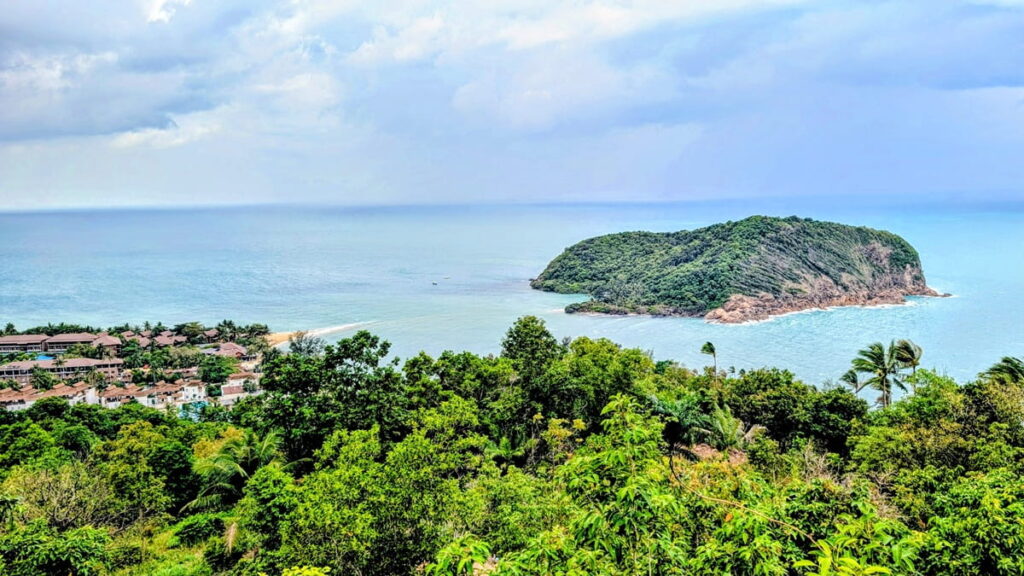 overhead view of a small island off the coast of Koh Pha Ngan in thailand on a partially cloudy day