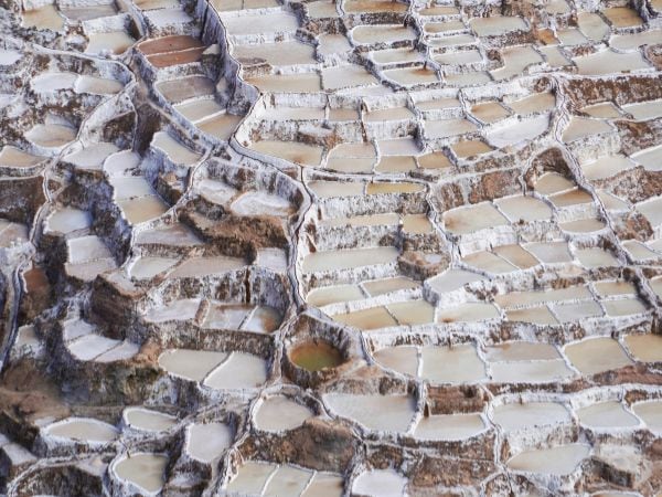 overhead shot of the grey salt fields in peru