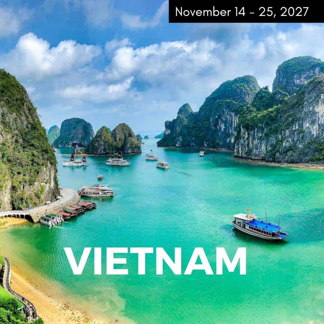 a bright and clear day in halong bay with bright green water surrounded by large rock formations used to promote a vegan tour to vietnam in 2027